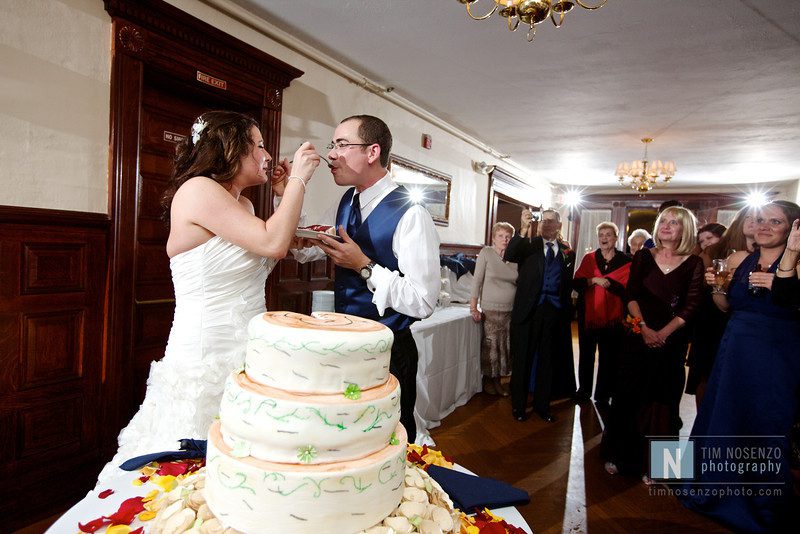 bride and groom sharing wedding cake