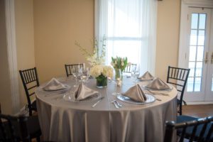 Weddings at Tarrywile silver linens white flowers clear plates