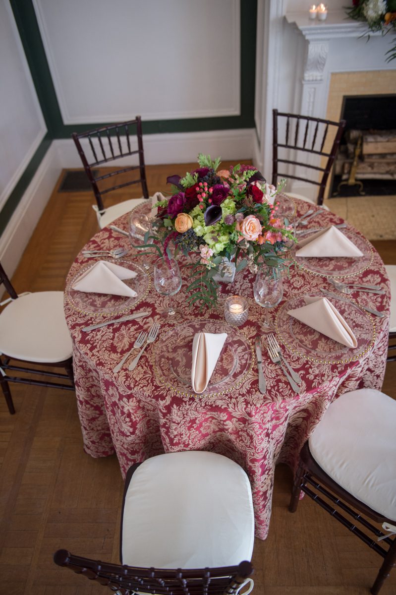 Weddings at Tarrywile paisley linnens with clear plates and white linens