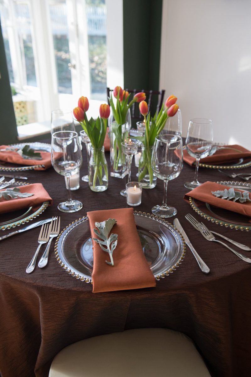 Weddings at Tarrywile Beautiful spring table settings in varying shades of brown with gold edged plates