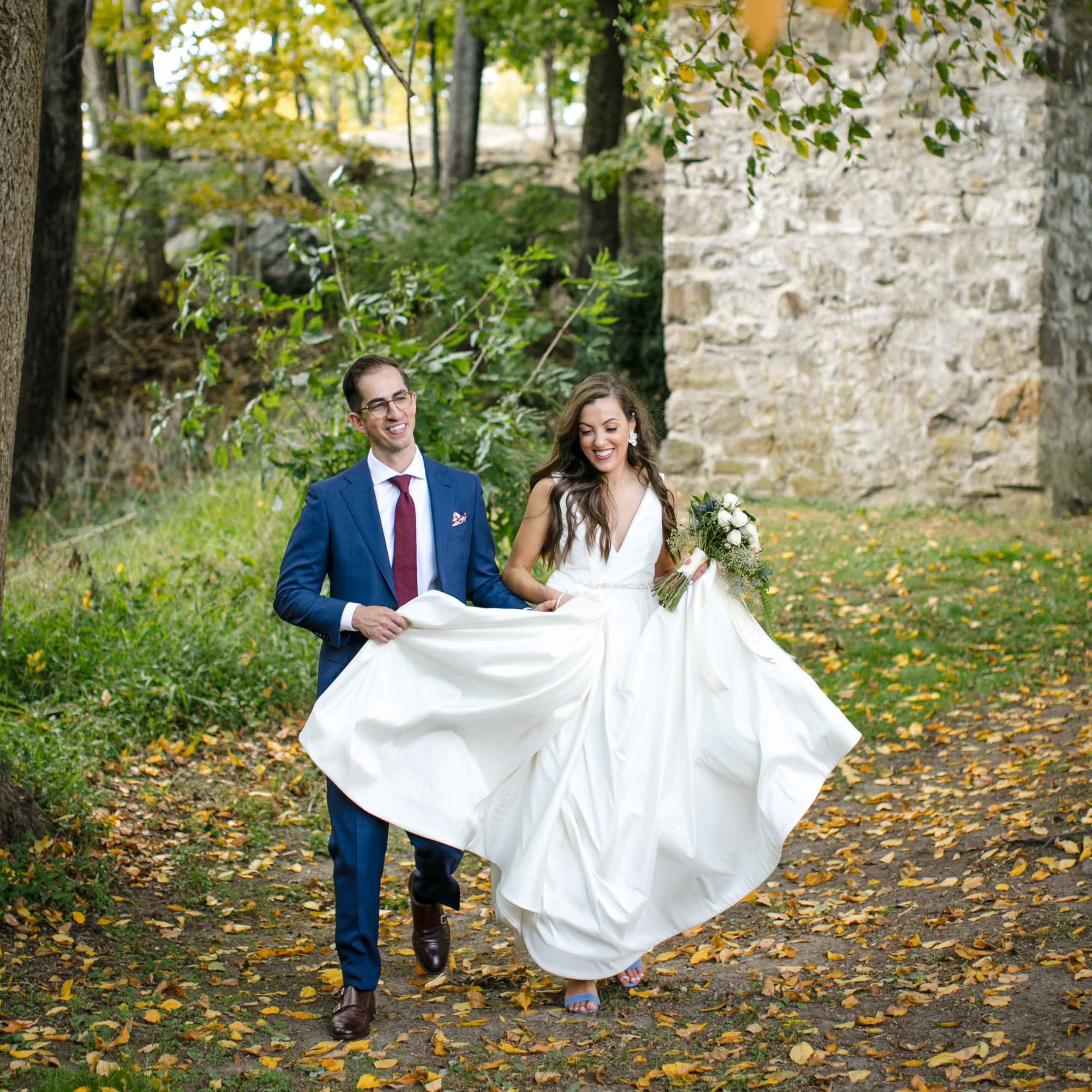 COVID-19 Won't Ruin our Wedding Day bride and groom walking on leaf strewn lawn