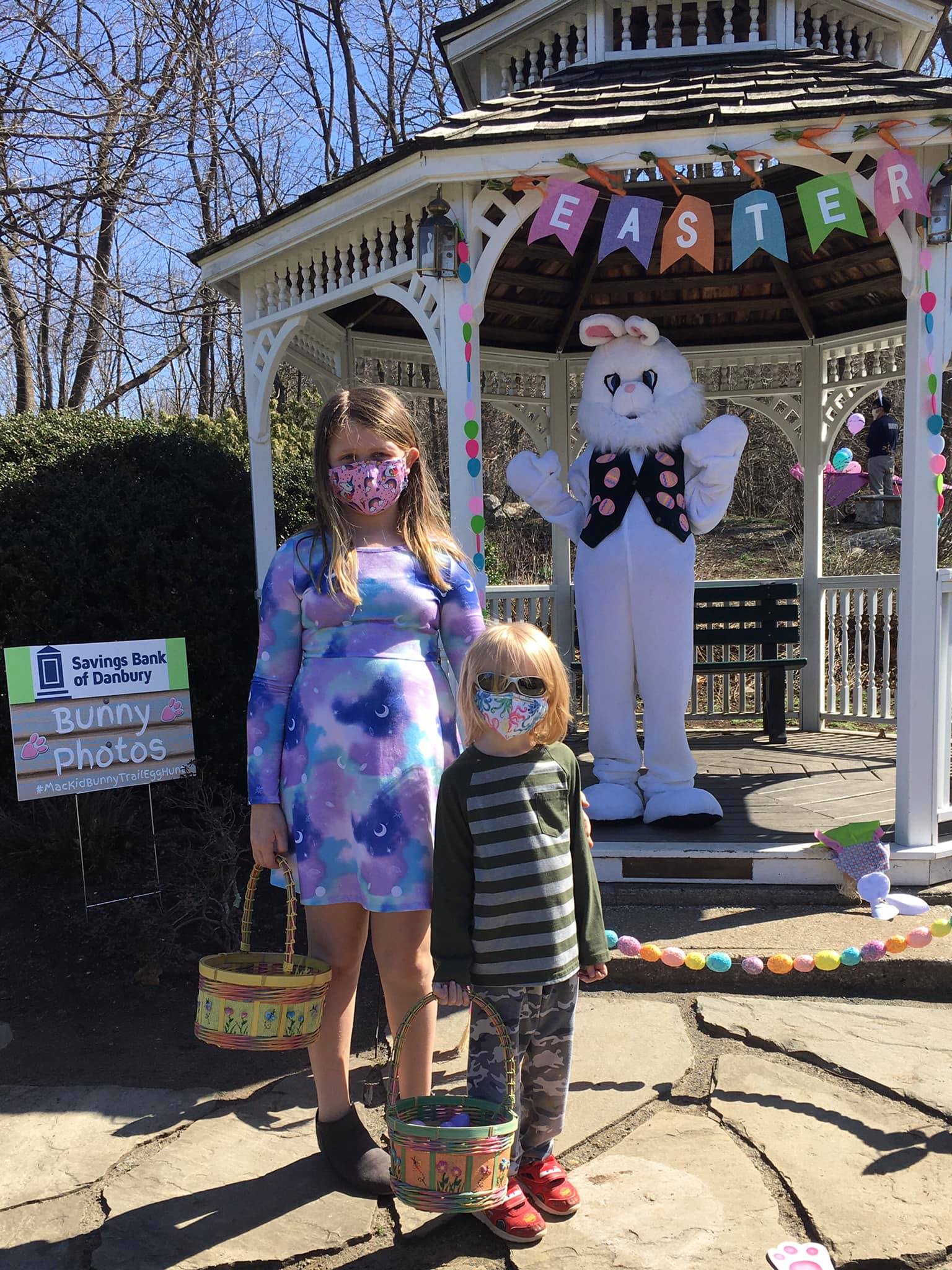 Bunny Trail Fundraiser girl and boy standing with easter bunny